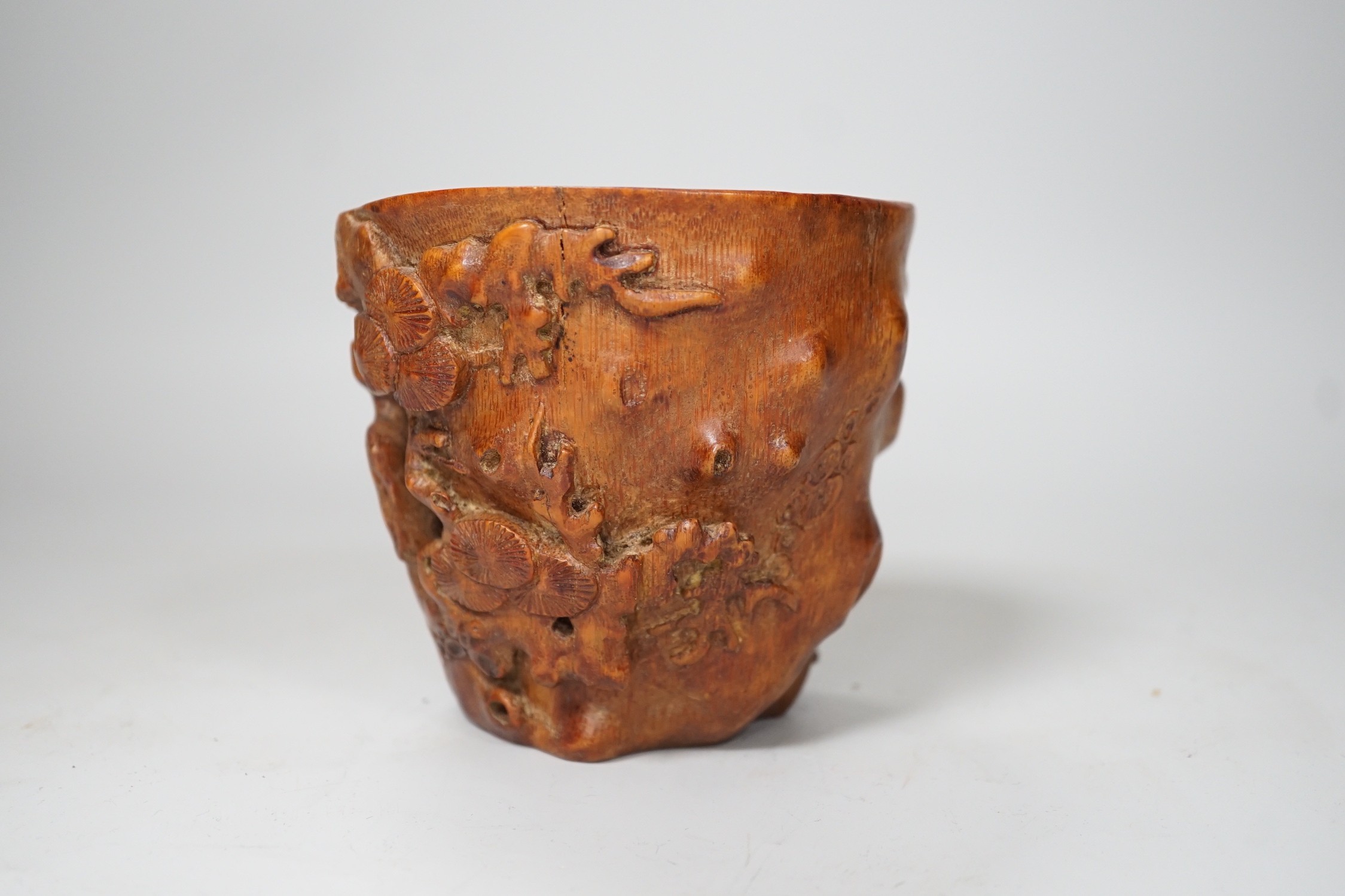 A Chinese bamboo libation cup. 10cm tall